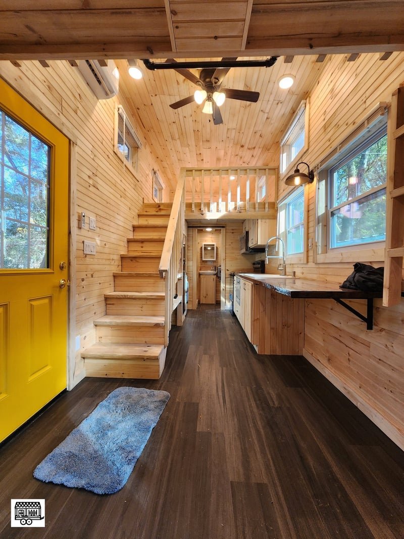 Craftsman Tiny Homes interior with staircase and kitchen
